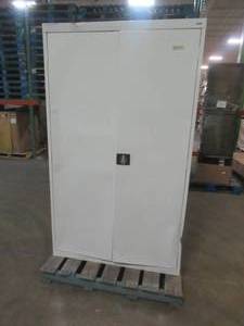 lot 536 image: SANDUSKY Cabinet, Approximate Dimensions 47 x 24 x 78 Tall. - Scratch and Dent, USED IN WAREHOUSE - Missing Key, lock works but does not catch hole on bottom due to bent doors.   SOLD AS PICTURED.