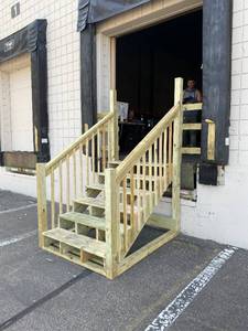 lot 563 image: Dock Height Wooden Staircase - Made for Loading dock entrance.  Nice and Sturdy. Approximate Dimensions 55 12 x 65 12 x 96 Tall. Top Stair is 45 from ground.