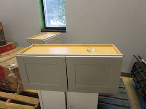 lot 9 image: HAMPTON BAY Shaker Assembled 36x15x12 in. Wall Bridge Kitchen Cabinet in Dove Gray (CABINET CRACKED ON SIDE, DOORS DO NOT MATCH UP, SEE PHOTOS)