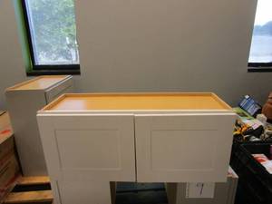 lot 10 image: HAMPTON BAY Shaker Assembled 36x15x12 in. Wall Bridge Kitchen Cabinet in Satin White (LITTLE SCUFFS, SEE PHOTOS)