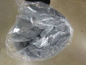 lot 40 image: GRAY PATIO CUSHION (STILL IN PLASTIC)