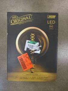 lot 60 image: FEIT 60-Watt Equivalent G63 Dimmable E26 Spiral Filament Oversized Amber Glass LED Vintage Edison LED Light Bulb Warm White (OPEN BOX)