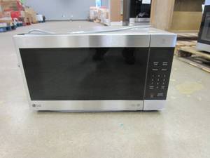 lot 205 image: LG NeoChef 24 in. Width 2.0 cu.ft. Stainless Steel 1200-Watt Countertop Microwave (BRAND NEW, DAMAGED ON TOP, SEE PHOTOS)