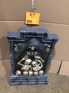 lot 15 image: 23.5in. RIP Skeletonal Headstone Open Box Customer Returns See Terms on Auction