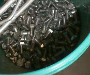 lot 27 image: 5 gallon pail over half full of bolts