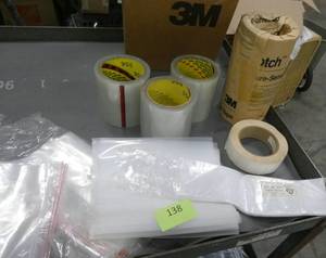 lot 138 image: Shipping supplies - 5 rolls of 4 inch wide label-covering tape, bags, labels