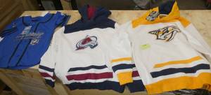 lot 145 image: 2 hoodies and 1 jersey, youth Medium