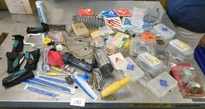 lot 191 image: Misc lot with pocket knives, flashlight, saw blades, storage bins, bulb planter, hardware, warning signs