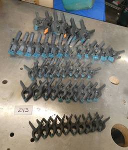 lot 243 image: Large group of plastic clamps - clearly someone needed more to do