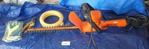 lot 267 image: Corded electric Black and Decker hedge trimmer, sprinkler, pruners and gloves