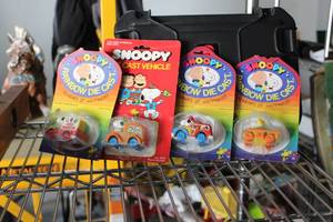 lot 128 image: Lot of (4) Snoopy Rainbow Diecast Collectibles (in original packaging)