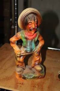 lot 217 image: 11 Gun For Hire Ceramic Table Statue