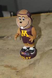 lot 377 image: 7 Goldy U of M Wrestling Bobble Head Doll