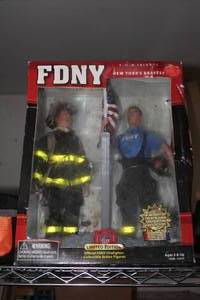 lot 318 image: 12 FDNY 9-11-01 Tribute Limited Edition Action Figure Set (in original packaging)