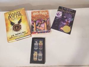 3 Harry Potter Books and a Collection of Hogwarts House Bookmarks
