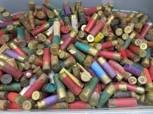 TOTE FULL OF VINTAGE SHOTGUN SHELLS