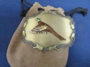 RAINTREE BELT BUCKEL IN LEATHER POUCH.