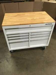 lot 36 image: Husky 46 in. W x 51 in. D Standard Duty 9-Drawer Mobile Workbench with Solid Top Full Length Extension Table in Gloss White Customer Returns See Terms on Auction