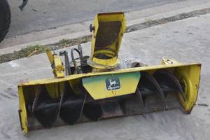 lot 44 image: John Deere 49 snow thrower with chains
