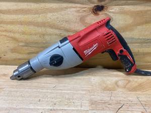 lot 33 image: MILWAUKEE 7.5 Amp Corded 12 in. Pistol Grip 2-Speed Hammer Drill