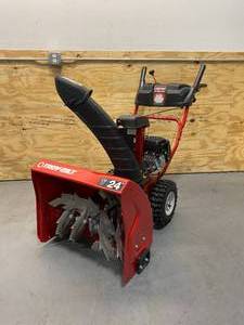 lot 5 image: TROY-BILT Storm 24 in. 208 cc Two- Stage Gas Snow Blower with Electric Start Self Propelled