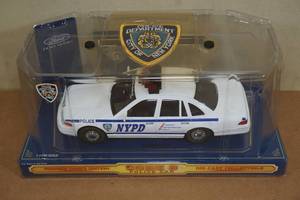 lot 129 image: Code 3 124 Scale NYPD Police Car with Patch