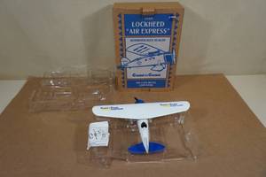lot 166 image: ERTL Coast to Coast 1929 Lockheed Air Express Die Cast Plane Bank