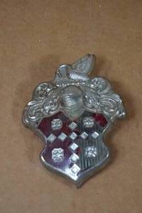 lot 174 image: 1955-56 Packard Hood Emblem