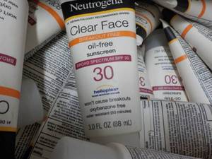 lot 269 image: Banana Box of Neutrogena 3 oz Tubes...