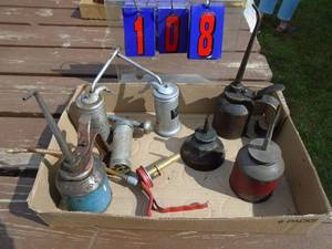 lot 108 image: Assortment on 8 vintage oil cans. As shown.
