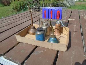 lot 110 image: Qty of 5 vintage oil cans. As shown.