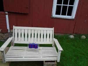 lot 117 image: Wood porch swing. Good condition. No chains. As shown.