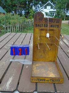 lot 121 image: True salted nuts counter display rack great patina. As shown.