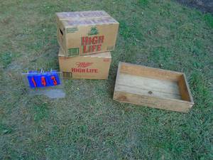 lot 143 image: Qty of 2 cardboard Miller High Life Beer cases & wood box. As shown.