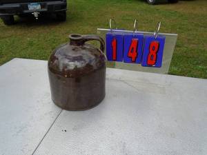 lot 148 image: Brown stoneare jug. No markings. As shown.