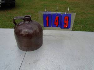 lot 149 image: Brown stoneare jug. No markings. As shown.