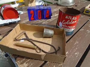lot 204 image: Flat with vintage atlas cance tongs measuring cup & brass pump. As shown.