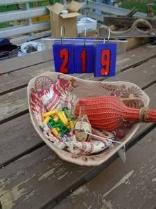lot 219 image: Basket of wine bottle & corn holders. As shown.