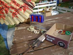 lot 227 image: Flat with umbrellas. 1 is nice. 1 needs help. Includes oriental figurines. As shown.