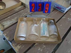 lot 239 image: Flat of milk bottles. As shown.