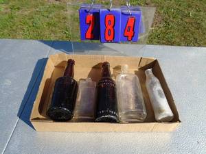 lot 284 image: Flat of glass bottles. As shown.