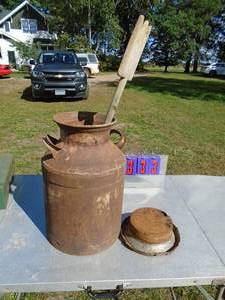 lot 333 image: Milk can with paddle. As shown.