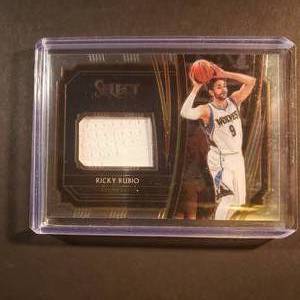 lot 104 image: Ricky Rubio Panini Select Patch No. TM-RRB