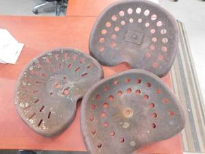 lot 11 image: 3 vintage tractor seats.