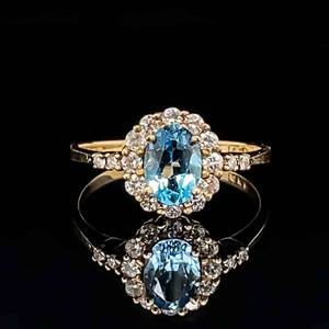 0.33ctw Diamond & Blue Topaz Oval Halo Cluster Ring in 14k Yellow Gold
