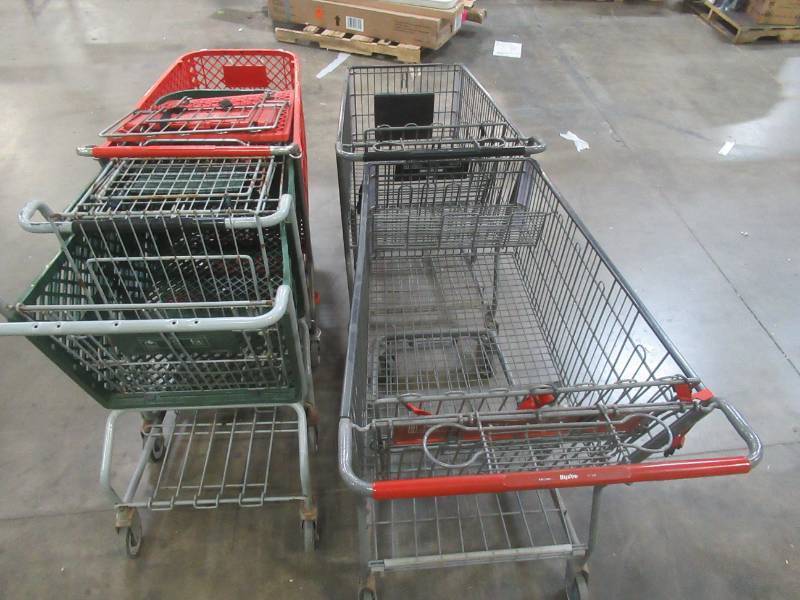 lot 560 image: 5 MISCELLANEOUS SHOPPING CARTS (2) Metal, (3) Plastic. Some have sticky wheels, but are in nice condition USE DIN RETAIL STORE.  SOLD AS PICTURED