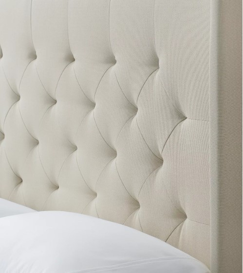lot 197 image: CREATED FOR MACYs JGW FURNITURE, Tall Upholstered Wingback Headboard Only in Cream. Did Not want to remove completely from packaging to keep clean.  Approximate Dimensions Without Feet 84 X 70 Tall.