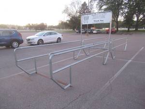 lot 4 image: DOUBLE CART CORRAL Approximate Dimensions 25 x 64 x 91 Tall. Used in Retail Store. Please Bring Proper transportation for removal. SOLD AS PICTURED