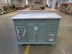 lot 300 image: Windlowe 49 in. W x 22 in. D x 35 in. H Bath Vanity in Green with Carrera Marble Vanity Top in White with White Sink (SMALL DINGS ON FRONT OF VANITY, NICE CONDITION OTHERWISE)