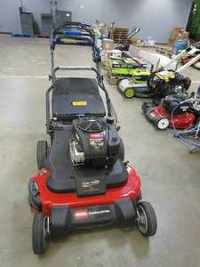 lot 462 image: TORO 21199 TimeMaster 30 in. Briggs & Stratton Personal Pace Self-Propelled Walk-Behind Gas Lawn Mower with Spin-Stop (RUNS, NICE CONDITION, SOME SCUFFS ON DECK)